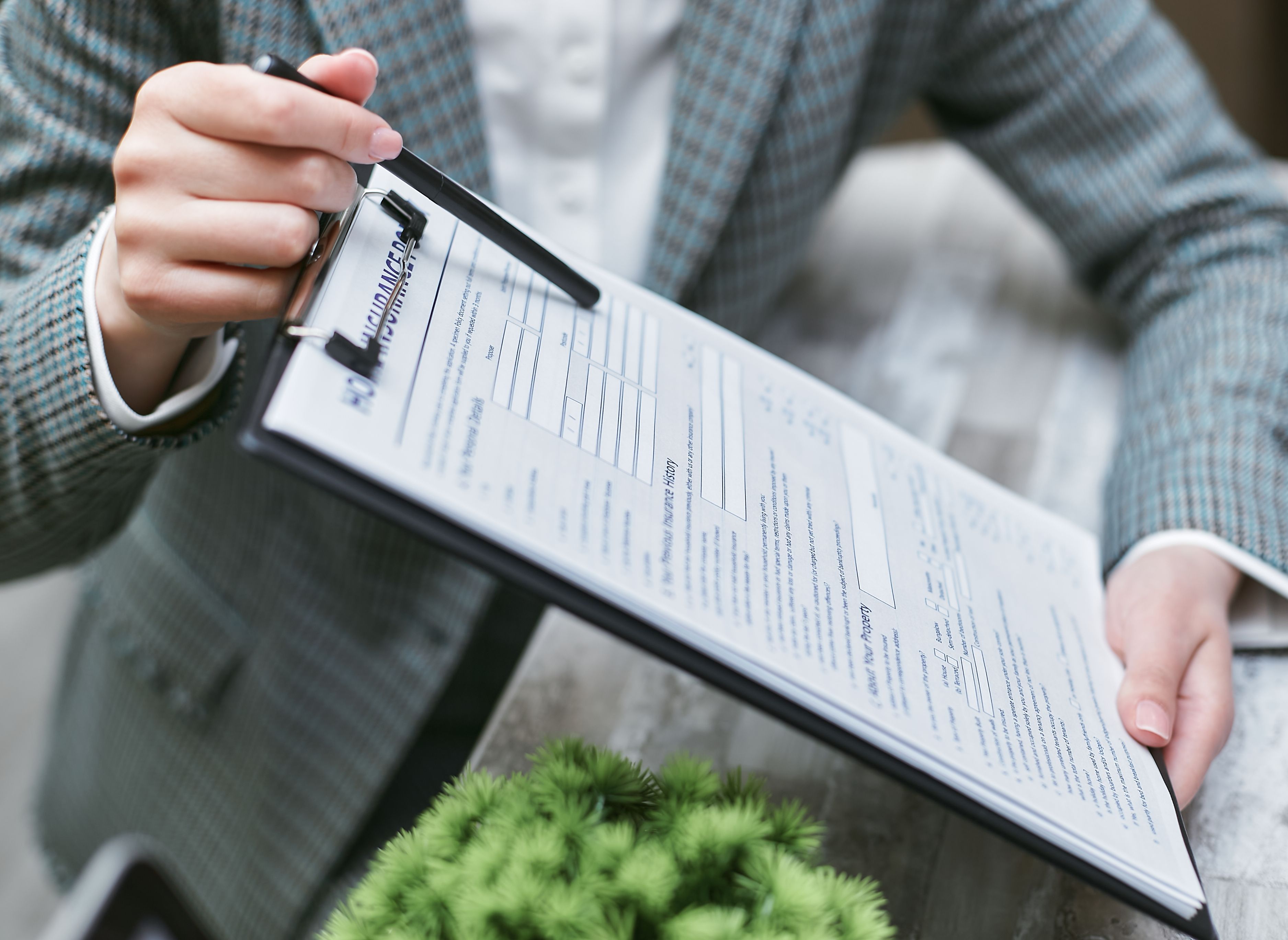 Researcher collecting information on a survey clipboard